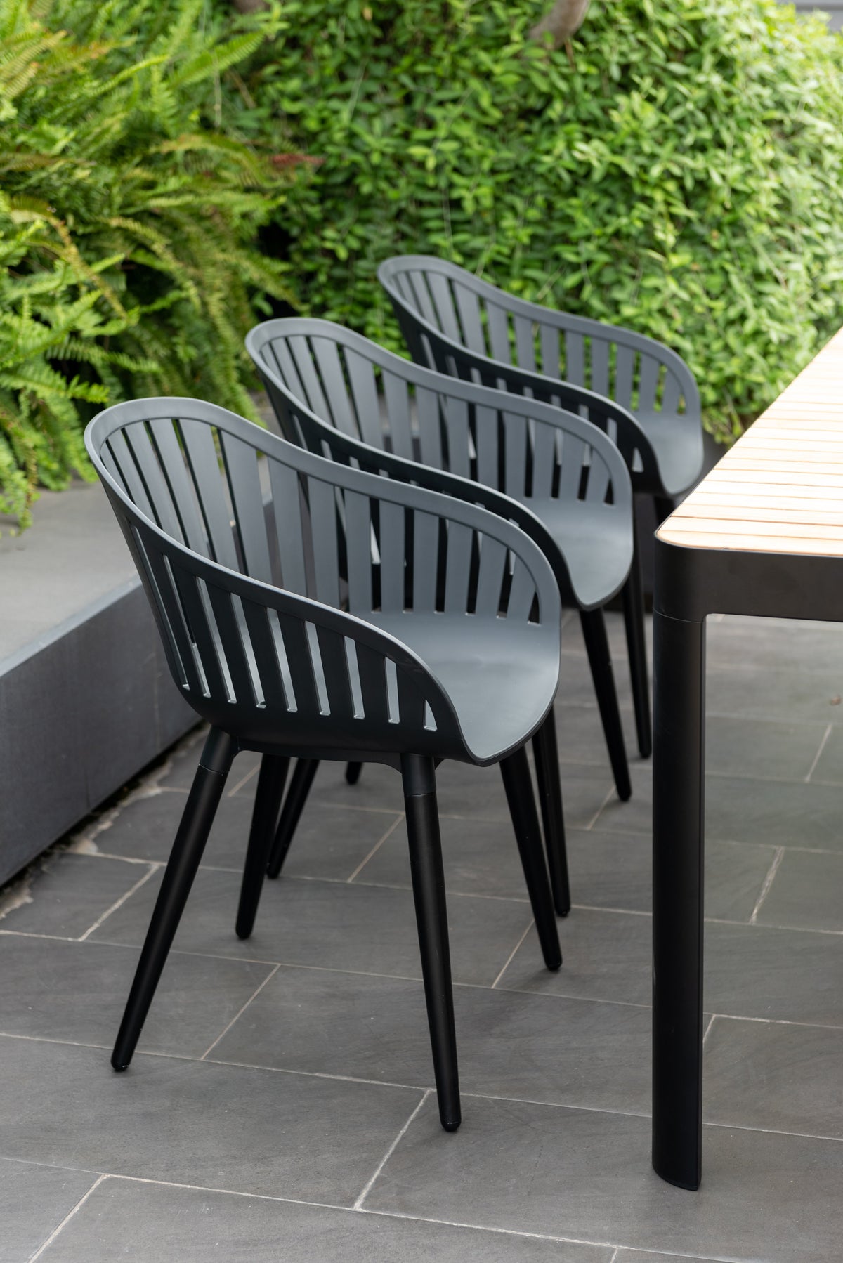 Portals Dark Dining Set | 7-Piece | FSC Teak Table & 6 Nassau Black Aluminum Social Plastic® Chairs | LifestyleGarden