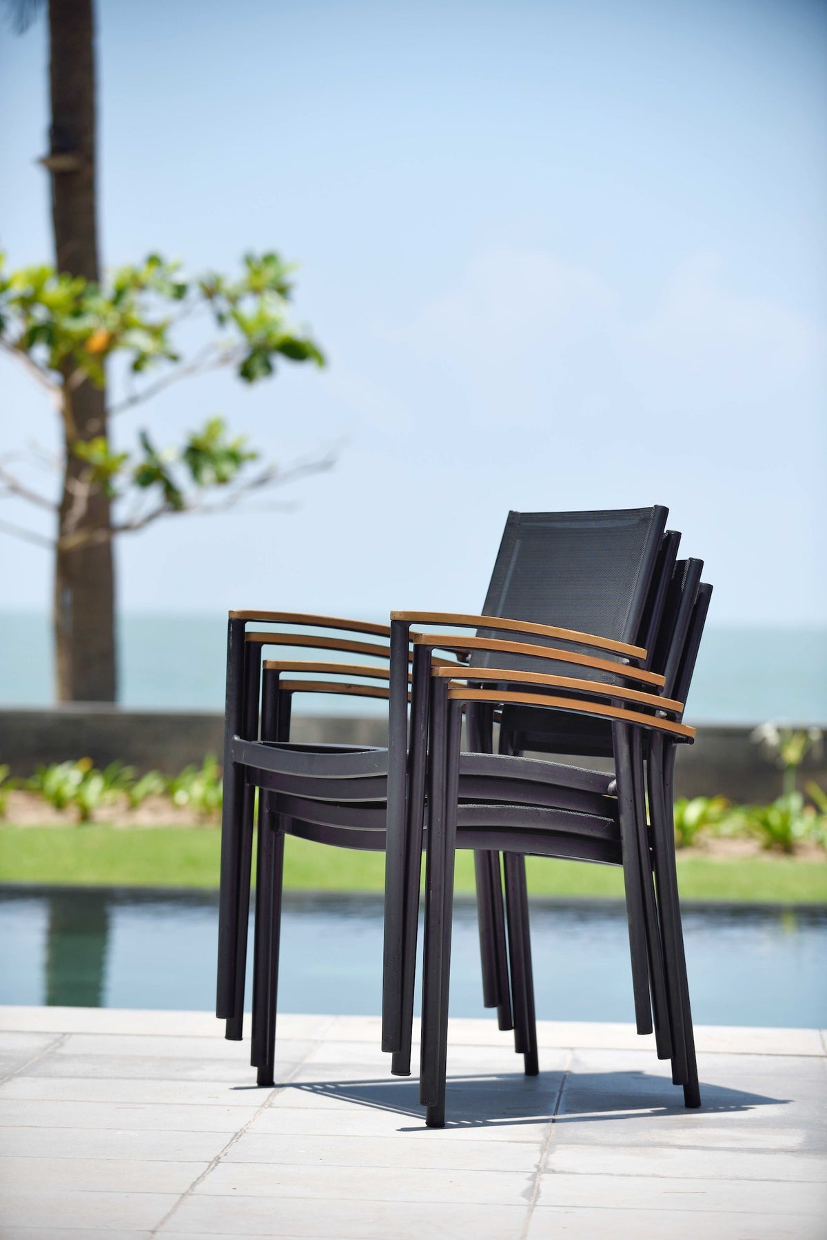 Rinjani 63" Teak Table & 4 Vera Stacking Armchairs | Aluminum, FSC Teak & Weather-net® | LifestyleGarden